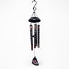 Black hanging wind chime with printed tubes and a floral pendant