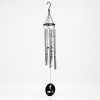 Hanging metal wind chime with a black cross and LOVE medallion