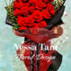 Bouquet of red roses with baby's breath and decorative gold loops