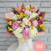 Large pastel bouquet in a white box with pink wrapping