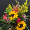 An autumnal vase arrangement with a mixture of designer's choice blooms.