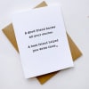 A white greeting card with a friendship message on a kraft envelope