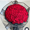 Large bouquet of red roses wrapped in black and gray paper