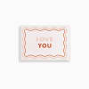 Greeting card with the words "LOVE YOU" in pink and orange