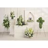 White and green floral funeral arrangements on stands and pedestals
