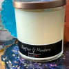 Scented candle in a glass jar with a bronze lid