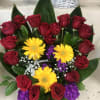 Bouquet of red roses with yellow gerbera daisies and purple filler flowers
