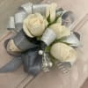 Cream rose corsage with silver ribbon and pearl accents