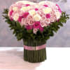 Large bouquet of pink and white roses with a pink ribbon wrap