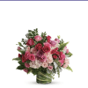 Pink and purple rose bouquet in a glass vase
