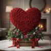 Heart-shaped arrangement of red roses in a wooden box with red ribbons