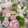 Pink and white rose bouquet with a "mother" sign