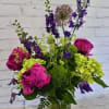 Pink and purple mixed bouquet in a glass vase