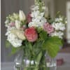 Bouquet of pink and white flowers in a clear glass vase