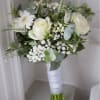 White rose bouquet with baby’s breath and eucalyptus wrapped in white ribbon