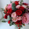 Bouquet of red and pink roses with eucalyptus