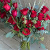 Bouquet of red roses in a clear glass vase
