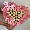 Heart-shaped box of pink roses with gold-wrapped chocolates and a pink ribbon