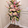 An elegant and heartfelt tribute, this standing spray showcases a refined blend