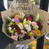 Mixed bouquet with a Happy Birthday sign and brown paper wrap