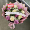 Bouquet of pink, lavender, and cream roses with a Happy Birthday ribbon