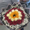 Bouquet of red and white roses with a sunflower center
