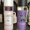 Two body mist bottles with white and black caps