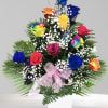 Colorful bouquet of roses with baby's breath in a white vase
