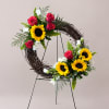 A bold, circular standing wreath that reads like a sunny celebration-perfect as