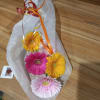 Wrapped bouquet of colorful gerbera daisies with ribbon curls