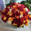Large bouquet of multicolored roses in red, pink, yellow, orange, and white