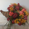 Cornucopia bouquet with red apples and mixed autumn flowers