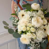 Large bouquet of white roses and gerbera daisies with eucalyptus