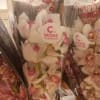 Wrapped orchid bouquets with white and pink blooms
