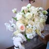 White rose and calla lily bouquet with pale peach accents