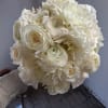Bouquet of white flowers held in hand