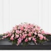 Pink floral casket spray with roses and carnations