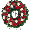 Red and white carnation wreath on a standing easel