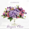 Purple and pink floral arrangement in a pedestal compote vase