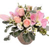 Pink lilies and roses in a glass vase