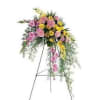 Pink and yellow floral spray on a standing easel