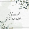 Watercolor-style head wreath sign with leafy border