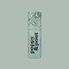 Mint-green lip balm tube with floral line art and bold text