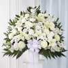 A serene, formal pedestal arrangement crafted for sympathy or funeral service. This
