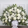 A serene white pedestal arrangement designed for sympathy or memorial services, this
