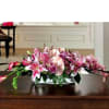 Low pink floral centerpiece in a rectangular container