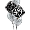 Cluster of black and white birthday balloons with a "40" balloon