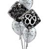 Cluster of black and white birthday balloons with star patterns