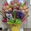 Birthday balloon bouquet in a yellow cone with unicorn balloons and tissue paper