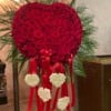 Heart-shaped red floral standing spray with white heart accents